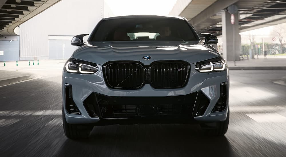 A silver 2022 BMW X4 is shown from the front after researching BMW lease deals.
