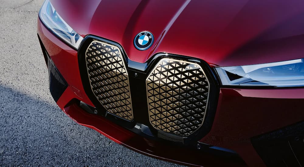 The red grille of a 2022 BMW iX is shown at a West Chester BMW dealership.