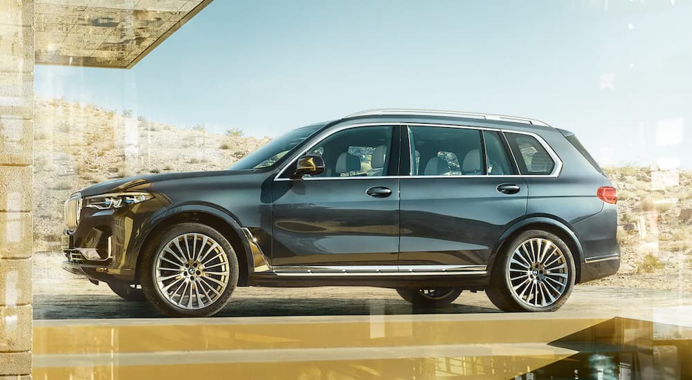 A popular used BMW for sale in Dayton, a 2020 BMW X7 is shown parked in a driveway.