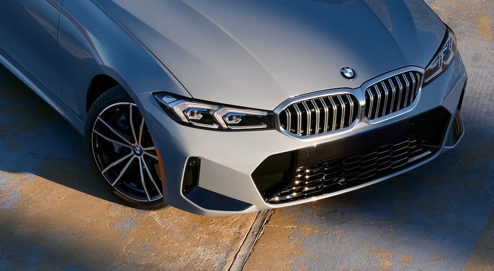 A close up shows the front end of a grey 2020 used BMW 3 Series for sale.
