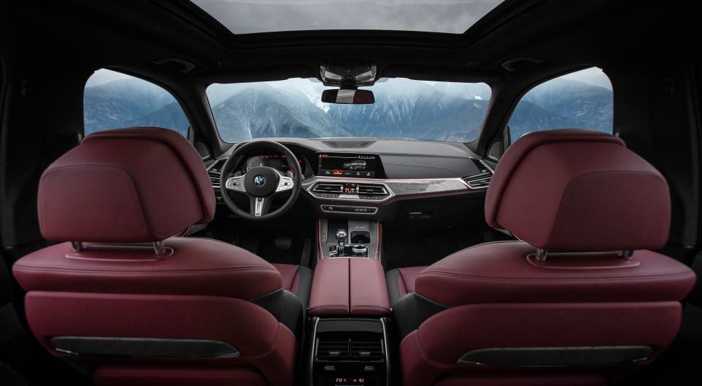 The black and red interior is shown in a  2023 BMW X5.